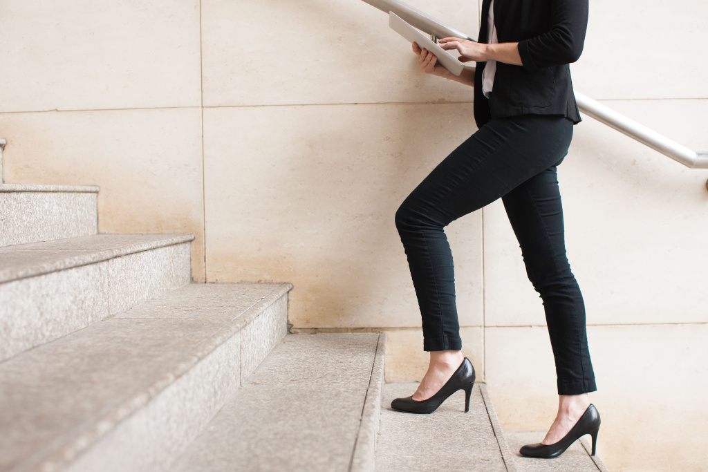 businesswoman-walking-upstairs-using-touchpad (1).jpg businesswoman-walking-upstairs-using-touchpad (1).jpg